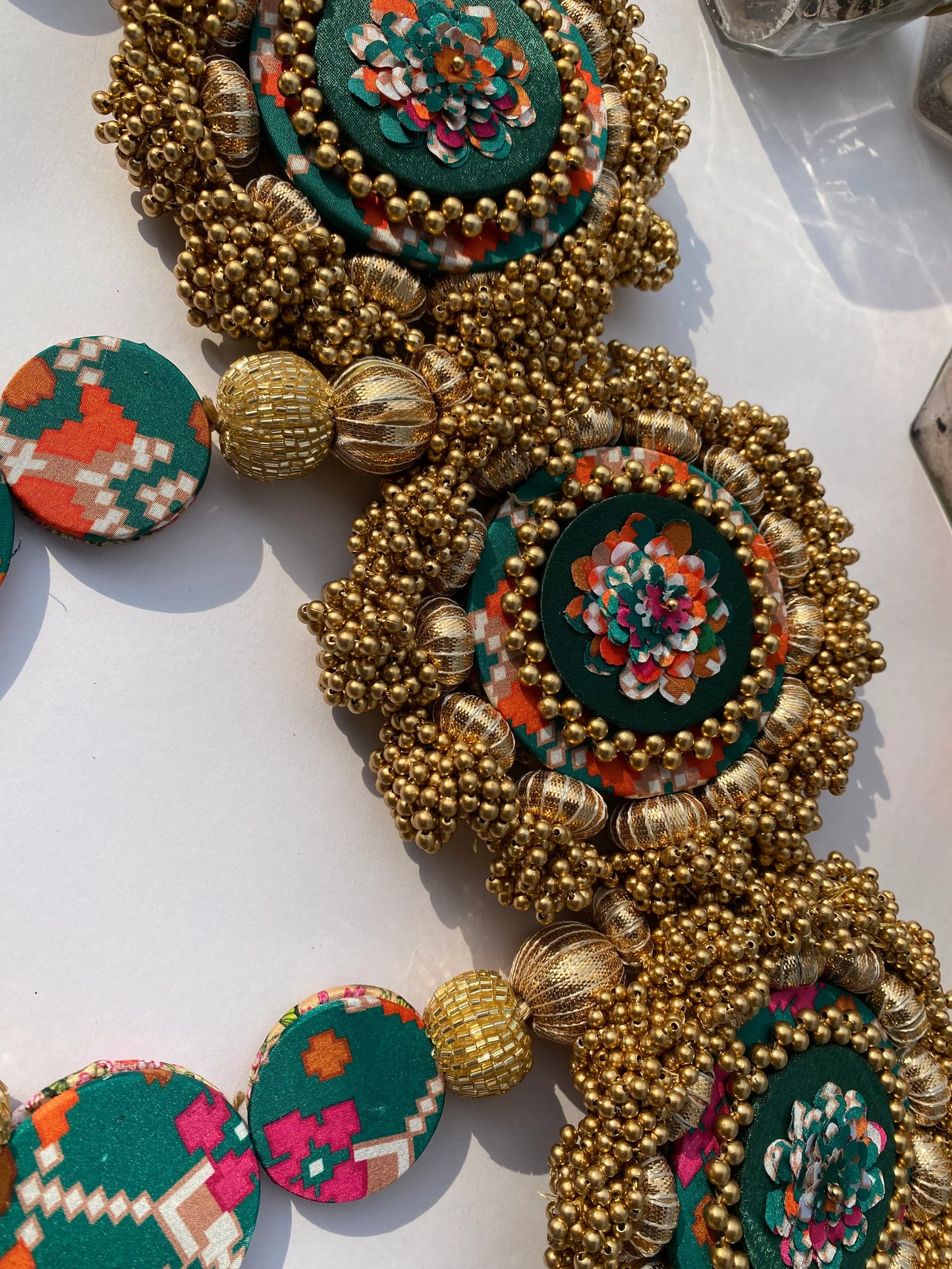 Chic-O-Fleek Dangler Colossal Toran 1: Bottle Green Navratna Patola & OG Infloresence Divine Pichwai Toran (Flexible)